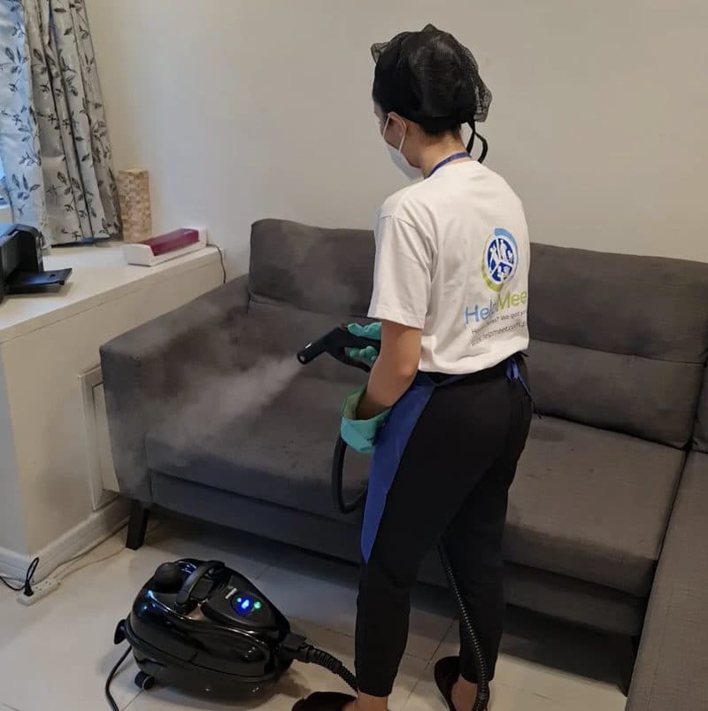 HelpMeet team member steam cleaning upholstery